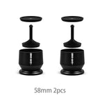 Pair of 58mm black coffee distributor tools with lids for espresso preparation