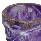 Purple and brown ceramic bowl with textured surface