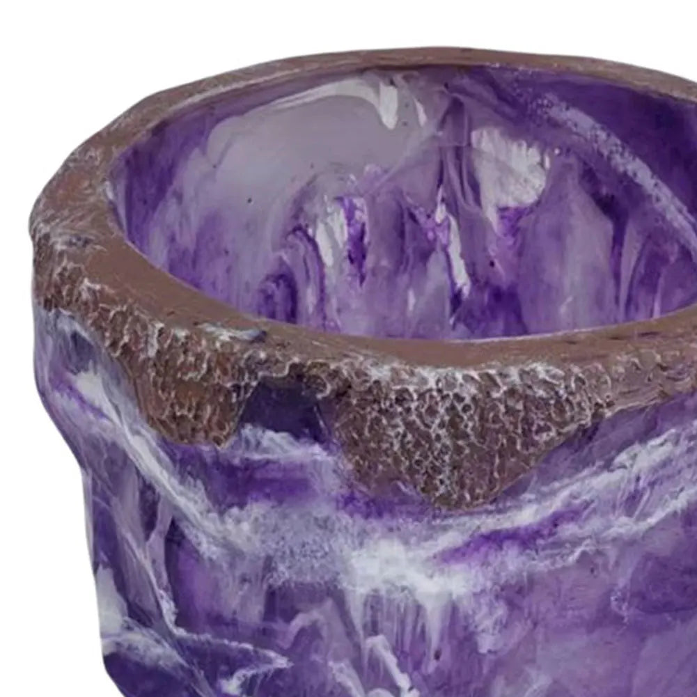 Purple and brown ceramic bowl with textured surface