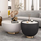 Two modern coffee tables, one white and one black, in a living room setting.