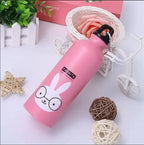 Pink water bottle with cartoon design on a decorative background