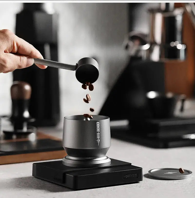 MHW-3BOMBER Coffee Dosing Funnel Aluminum Alloy Dosing Shaker in use with espresso machine, fits 51-54mm portafilters for home barista setup.