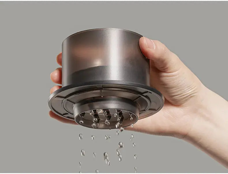 Water dripping from the TIMEMORE SimpleDrip Water Dropper, demonstrating its precision and uniform flow control.