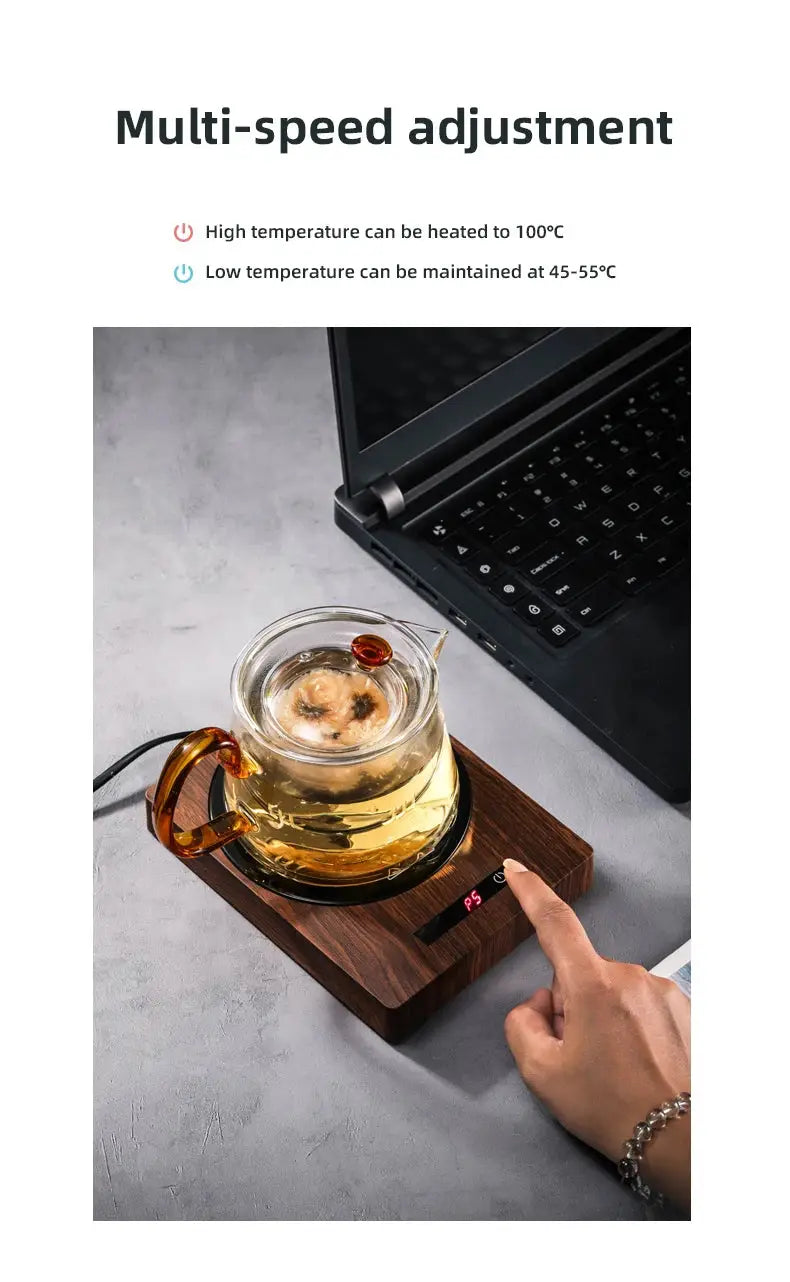 100°C Cup Heater Mug Warmer with automatic power-off, shown warming tea in a glass teapot on a wooden heating pad, ideal for hot beverages.