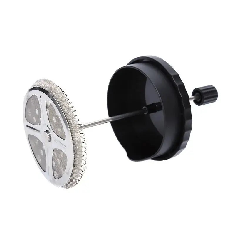 Close-up of a stainless steel plunger and fine mesh filter from a French Press Coffee Maker. Ensures smooth, grit-free coffee extraction.