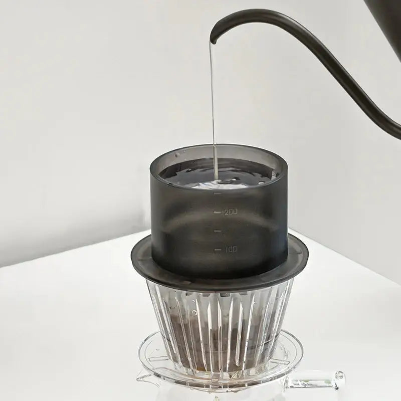 TIMEMORE SimpleDrip Water Dropper placed on a coffee dripper, ensuring controlled and uniform water distribution.