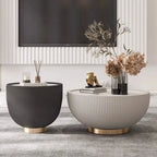 Two modern side tables with decorative items in a living room setting.