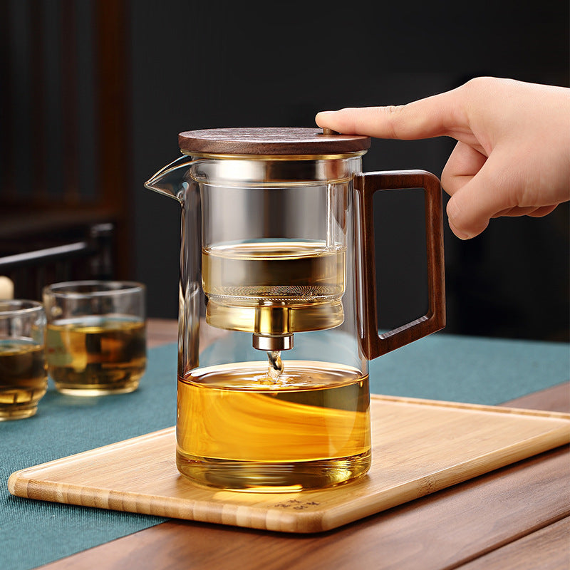 Elegant glass teapot showcasing tea brewing process