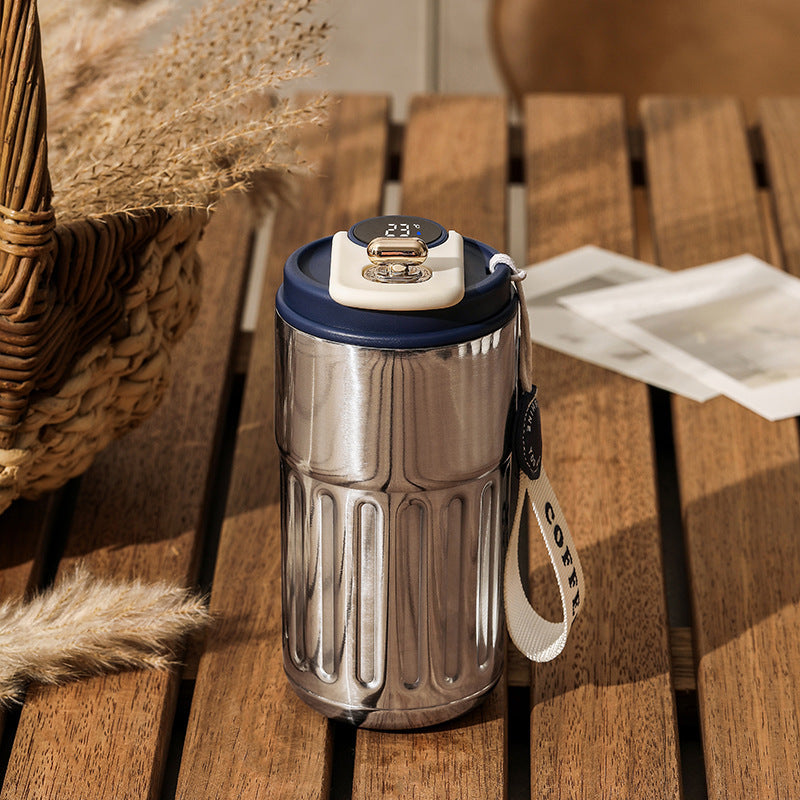 Stainless steel smart digital thermal bottle with blue lid and temperature display, 450ml. Ideal for coffee and tea lovers who need long-lasting insulation.