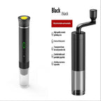 Black capsule coffee machine with a detachable manual grinder, featuring an adjustable ceramic grinding core for fresh coffee preparation.