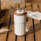 White smart digital thermal bottle with brown lid and temperature display, 450ml. Stylish and functional insulated coffee mug for daily use.