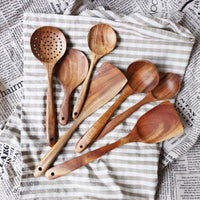 Teak wooden spoon set on a table cloth