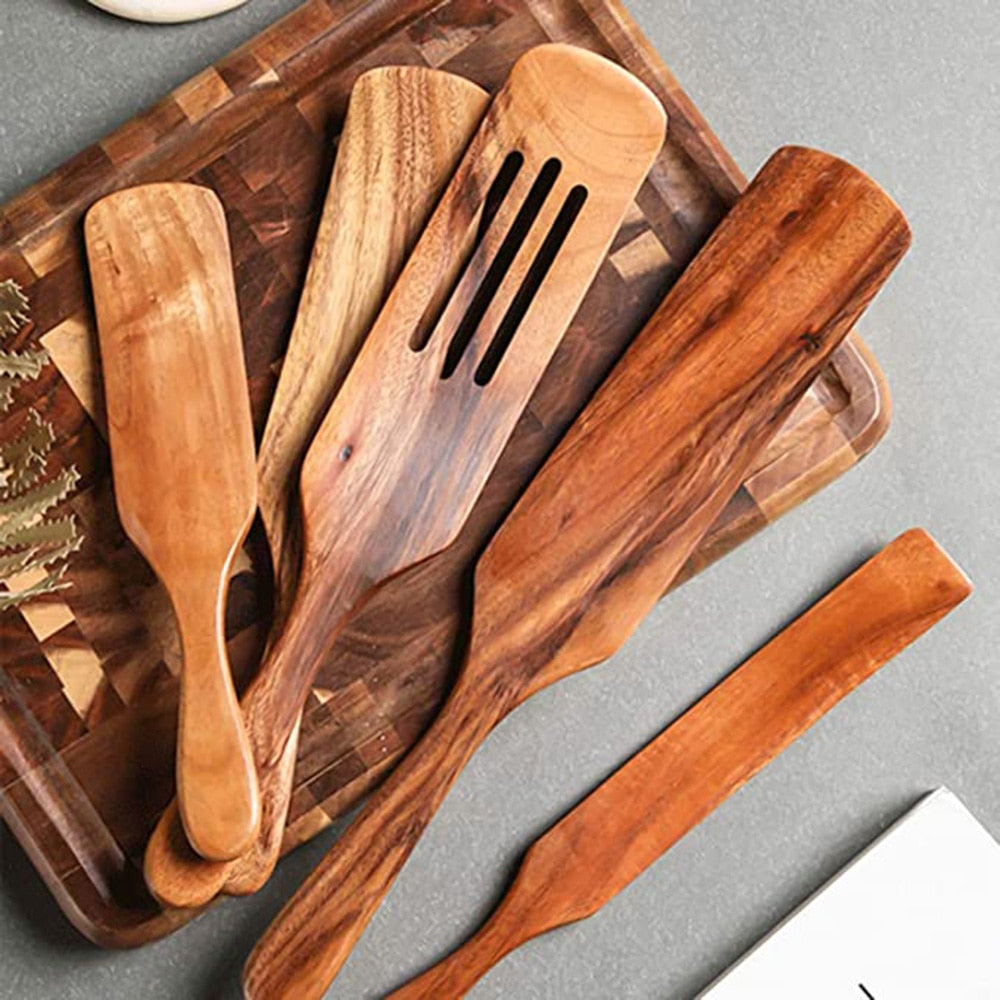 Cooking with Teak Wooden Utensils in a pan