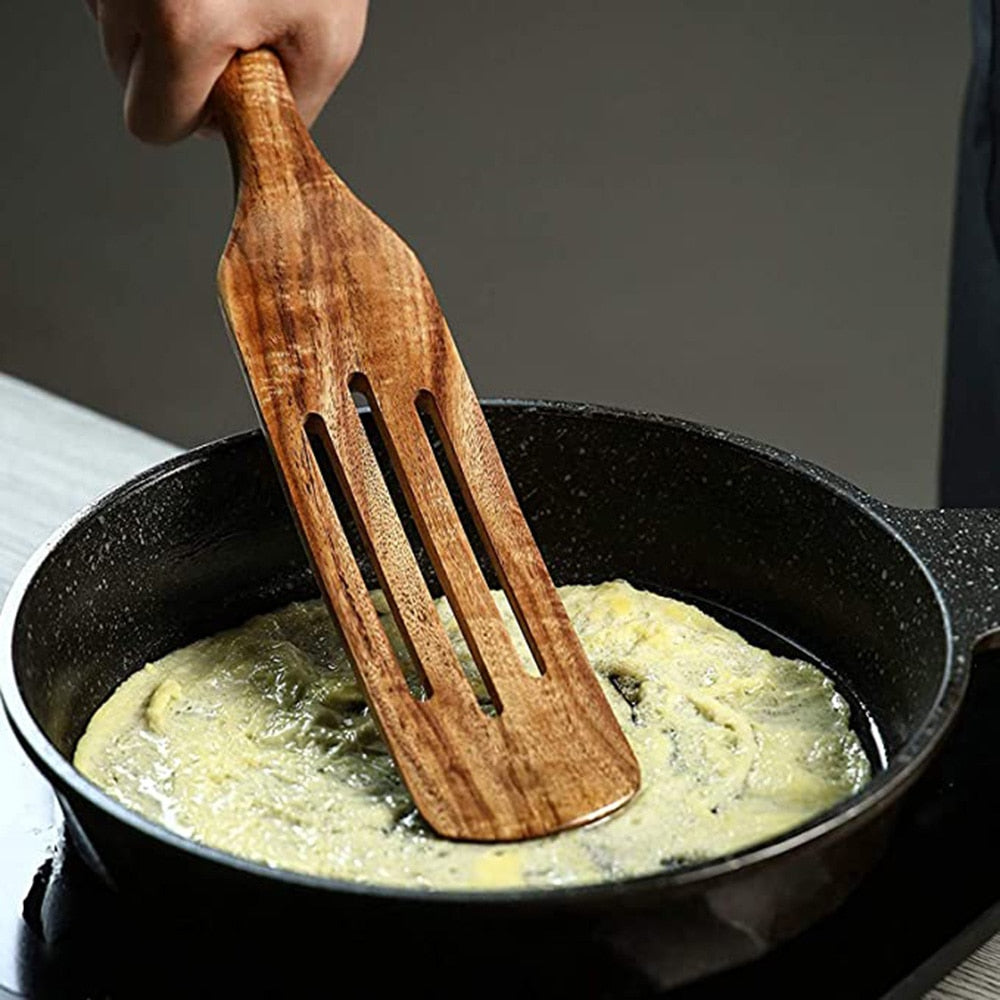 Teak wooden spatula in a frying pan