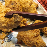 Close up of wooden meat holder spatula