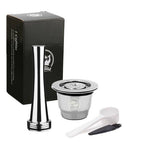 Reusable coffee pods set with stainless steel refillable capsules, tamper, scoop, and brush. Eco-friendly and compatible with Nespresso machines.